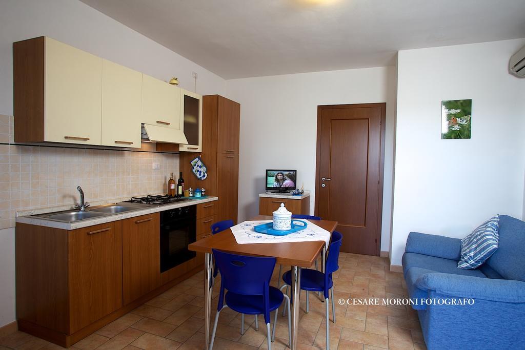 Residence Ai Campi Da Golf Сатурния Номер фото